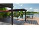 Enjoy the waterfront view from the large deck, complete with seating and a pergola at 2347 Foggy Ridge Pkwy, Land O Lakes, FL 34639