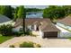 Charming home with manicured landscaping, brick driveway, and a welcoming entrance; perfect curb appeal at 2347 Foggy Ridge Pkwy, Land O Lakes, FL 34639