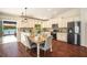 Well-appointed kitchen featuring granite counters, stainless steel appliances, and lake views at 2347 Foggy Ridge Pkwy, Land O Lakes, FL 34639