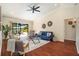 Cozy living room with hardwood floors and sliding glass doors to outdoor patio at 2347 Foggy Ridge Pkwy, Land O Lakes, FL 34639