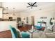Bright living room featuring an open-concept design with access to the kitchen and dining area at 2347 Foggy Ridge Pkwy, Land O Lakes, FL 34639