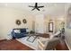 Living area features hard wood floors, a large ceiling fan, and access to the entry way at 2347 Foggy Ridge Pkwy, Land O Lakes, FL 34639