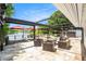 Luxurious outdoor patio featuring comfortable seating, a fire pit, and scenic lake views at 2347 Foggy Ridge Pkwy, Land O Lakes, FL 34639