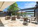 Beautiful outdoor living space with stone patio, awning, and view of the water at 2347 Foggy Ridge Pkwy, Land O Lakes, FL 34639