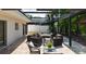Beautiful outdoor patio with pergola, heaters, and plenty of seating for entertaining guests at 2347 Foggy Ridge Pkwy, Land O Lakes, FL 34639