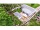 Aerial view of a property with a well-kept yard, shed, and outdoor seating area at 2616 Fairway S Ave, St Petersburg, FL 33712