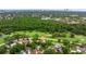 Aerial image of a home near a golf course and lush wooded area, offering a serene setting at 2616 Fairway S Ave, St Petersburg, FL 33712