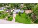 Charming home with a well-manicured lawn, mature trees, and inviting curb appeal in a peaceful neighborhood at 2616 Fairway S Ave, St Petersburg, FL 33712
