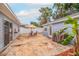 Cozy backyard patio with an umbrella and seating for outdoor dining and relaxation at 2616 Fairway S Ave, St Petersburg, FL 33712