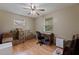 Bedroom featuring natural light from the windows, hardwood floors, and a ceiling fan at 2616 Fairway S Ave, St Petersburg, FL 33712