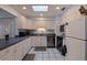 Functional kitchen featuring white cabinets, modern appliances, and ample counter space for meal preparation at 2616 Fairway S Ave, St Petersburg, FL 33712