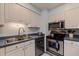 Efficient kitchen equipped with modern appliances, providing a practical space for culinary endeavors at 2616 Fairway S Ave, St Petersburg, FL 33712