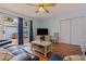 Cozy living room featuring wood floors, a comfortable sofa, and access to the outdoor patio at 2616 Fairway S Ave, St Petersburg, FL 33712
