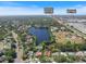 Aerial view of property near recreation center and mall with a lake at 2673 Clubhouse S Dr, Clearwater, FL 33761