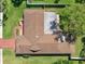 Aerial view of the home showcasing the roof, patio area, and surrounding green lawn at 2673 Clubhouse S Dr, Clearwater, FL 33761