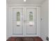 Elegant double front doors with decorative glass panels welcome you inside this home at 2673 Clubhouse S Dr, Clearwater, FL 33761