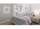 Comfortable bedroom with pink accents, stylish artwork, and a bright window at 29152 Coral Harbour Dr, Englewood, FL 34223