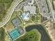 An aerial photograph of an outdoor community center with tennis courts, an activity field, a pool, and parking at 29356 Ginnetto Dr, Wesley Chapel, FL 33543