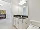 Clean powder room with granite countertop and modern fixtures at 29356 Ginnetto Dr, Wesley Chapel, FL 33543