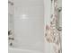 Bathroom features a shower-tub combination with a modern shower head and towel rack at 29356 Ginnetto Dr, Wesley Chapel, FL 33543