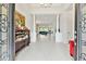 Grand foyer featuring tile floors, columns, and decorative furnishings with an open floor plan at 29356 Ginnetto Dr, Wesley Chapel, FL 33543