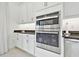 Modern kitchen featuring stainless steel appliances, wall oven, and granite countertops at 29356 Ginnetto Dr, Wesley Chapel, FL 33543