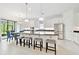 Bright, open kitchen with a large island, stainless steel appliances, and an adjacent dining area at 29356 Ginnetto Dr, Wesley Chapel, FL 33543