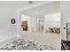 Open-concept living area flows into dining space, showcasing bright white walls and light hardwood floors at 29356 Ginnetto Dr, Wesley Chapel, FL 33543