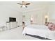 Spacious main bedroom with white walls, plush carpet, and large windows offering natural light at 29356 Ginnetto Dr, Wesley Chapel, FL 33543