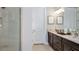 Bathroom showcasing double sinks, spacious countertop and walk-in shower at 29936 Rusco Ct, Wesley Chapel, FL 33543