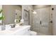 Bathroom featuring a glass enclosed shower, sleek vanity, and neutral finishes at 29936 Rusco Ct, Wesley Chapel, FL 33543