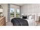 Comfortable bedroom with soothing decor, a plush bed, and natural light from the window at 29936 Rusco Ct, Wesley Chapel, FL 33543