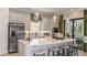 Bright kitchen with a large island, stainless steel appliances, and seamless access to the outdoor patio at 29936 Rusco Ct, Wesley Chapel, FL 33543