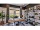 Stylish home office with a modern desk, shelving, and decor for a productive workspace at 29936 Rusco Ct, Wesley Chapel, FL 33543