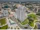 An aerial view of a high-rise condominium in a lively urban setting, near green spaces and city amenities at 331 Cleveland St # 402, Clearwater, FL 33755