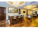 Stylish bar area featuring a marble countertop, wood floors, and seating for three at 331 Cleveland St # 402, Clearwater, FL 33755