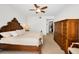 Bright bedroom featuring a ceiling fan, walk in closet, and a wooden armoire at 331 Cleveland St # 402, Clearwater, FL 33755