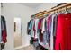 Walk-in closet with upper storage and clothing racks at 331 Cleveland St # 402, Clearwater, FL 33755