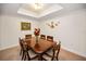 Elegant dining room with a wood table, seating for six, and classic decor at 331 Cleveland St # 402, Clearwater, FL 33755