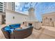 Inviting outdoor fireplace and comfortable seating area with plenty of room to relax at 331 Cleveland St # 402, Clearwater, FL 33755
