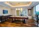 Inviting game room featuring a pool table, bar area, and comfortable seating at 331 Cleveland St # 402, Clearwater, FL 33755