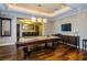 Spacious game room with a pool table, bar, and entertainment center at 331 Cleveland St # 402, Clearwater, FL 33755
