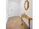 Condo hallway featuring decorative table and mirror at 331 Cleveland St # 402, Clearwater, FL 33755