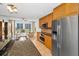 Modern kitchen showcasing stainless steel appliances, granite countertops and an open view to the living area at 331 Cleveland St # 402, Clearwater, FL 33755