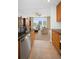 Well-designed kitchen with wood cabinets, stainless steel dishwasher and countertop view into the living area at 331 Cleveland St # 402, Clearwater, FL 33755