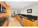 Open kitchen with granite counters and stainless steel appliances, next to dining area, perfect for entertaining at 331 Cleveland St # 402, Clearwater, FL 33755