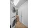 Laundry room with stacked washer and dryer and storage at 331 Cleveland St # 402, Clearwater, FL 33755