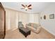 Bright living room with comfortable furniture and ample natural light flowing through the large windows with blinds at 331 Cleveland St # 402, Clearwater, FL 33755