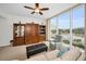 Inviting living room featuring large windows, comfortable seating and elegant built-in shelving and cabinets at 331 Cleveland St # 402, Clearwater, FL 33755