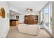 Relaxing living room with plush seating, large windows, and an open layout that leads to the kitchen at 331 Cleveland St # 402, Clearwater, FL 33755